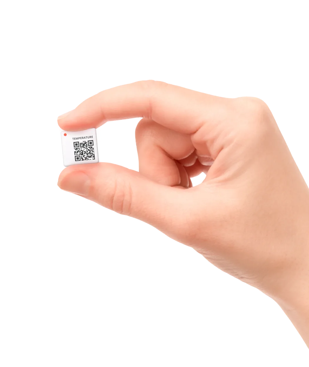 Der kompakte Temperatursensor von Disruptive Technologies zwischen zwei Fingern